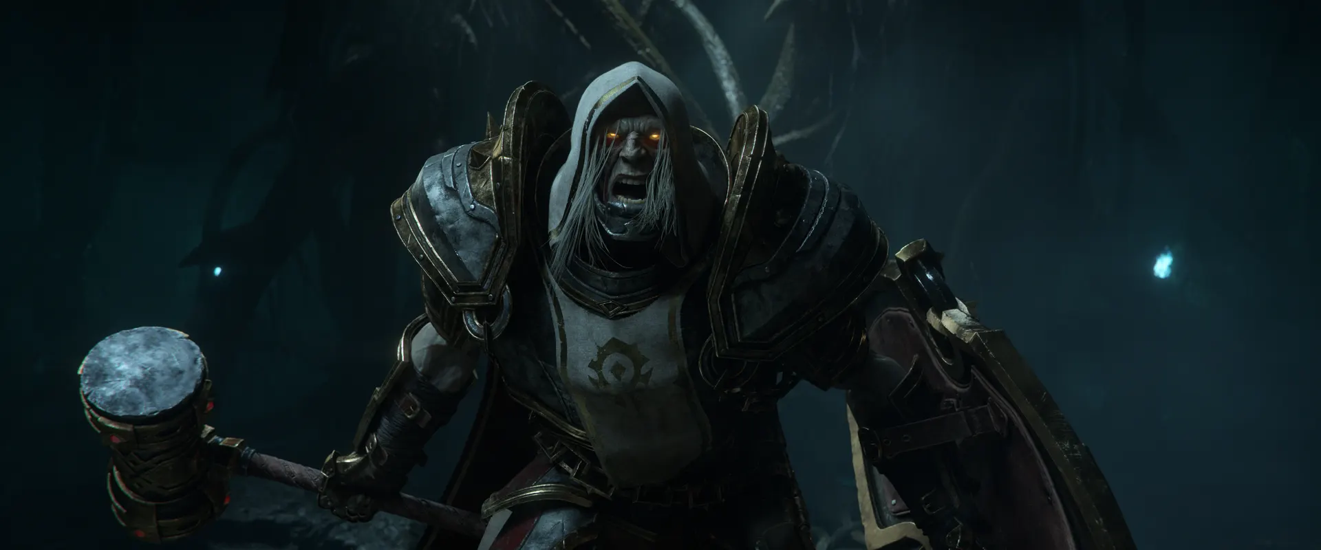 A hooded Forsaken fighter in heavy plate armour, with a hammer and shield, shouting in a dark cavern, from the WoW Forever launch cinematic