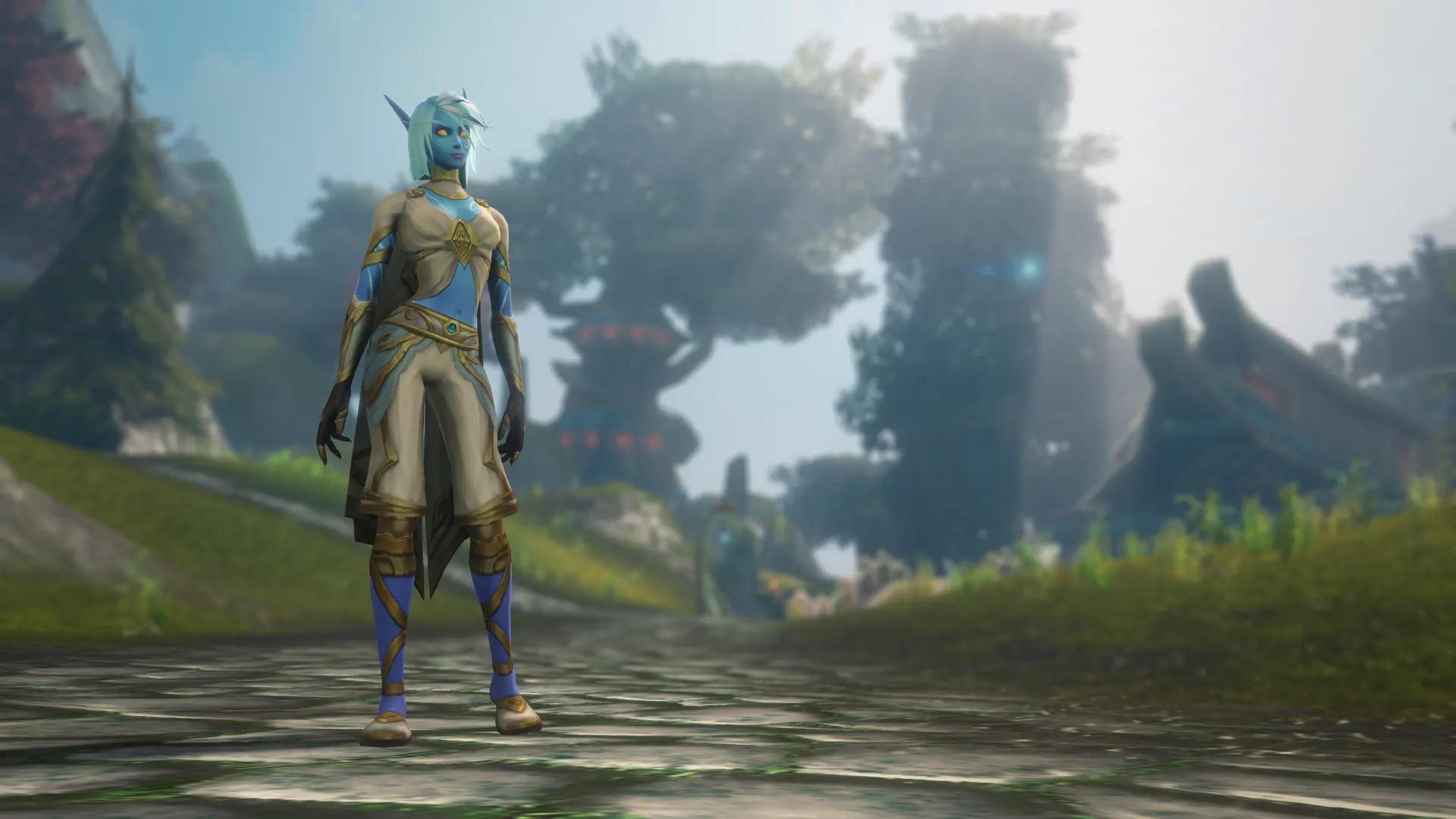 A blue-skinned Skyborne character standing on a stone path in a sunlit forest